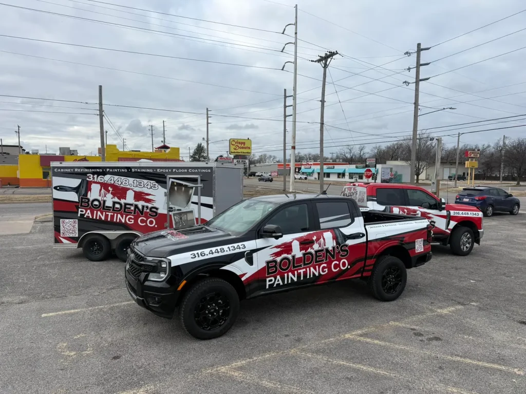 Bolden’s Painting branded trucks and equipment trailer.