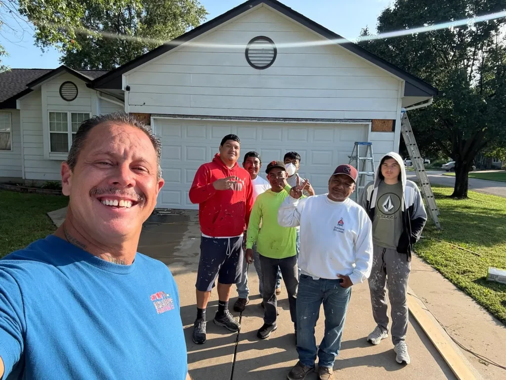 Bolden’s Painting crew outside a house during an exterior project.